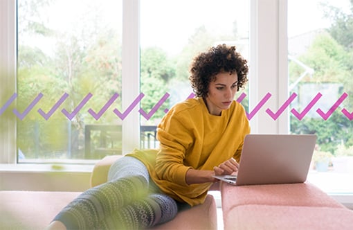 Silent Authentication - content image Woman using laptop on couch at home